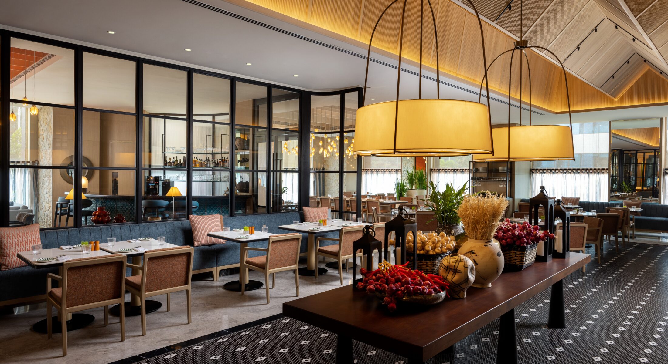 Mercato restaurant at Pullman Chennai Anna Salai featuring modern interiors, live kitchen, and global multi cuisine buffet dining experience in Chennai