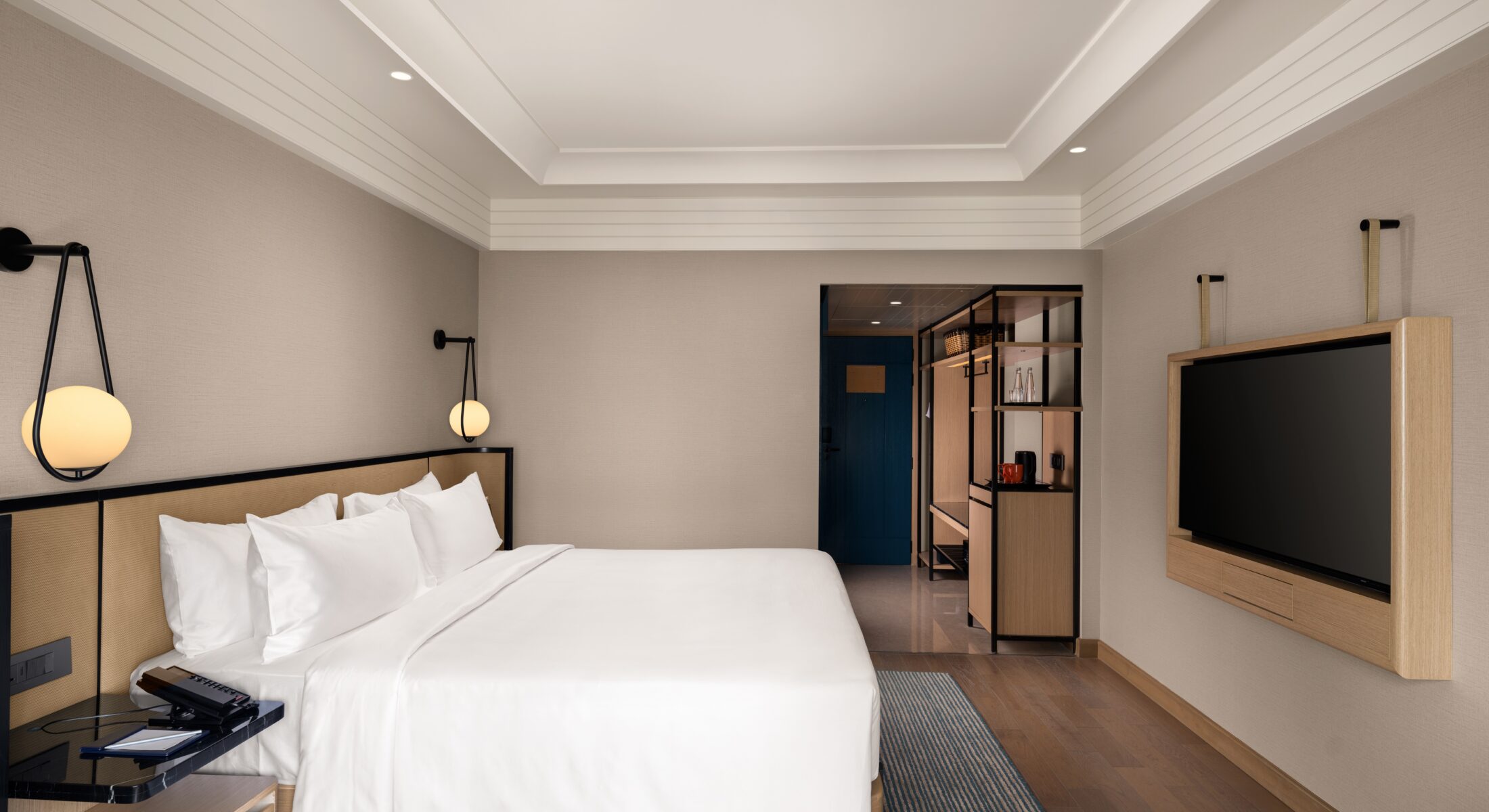 Superior Club Room with king-size bed, modern interiors, workspace, and Chennai city views at Pullman Chennai Anna Salai